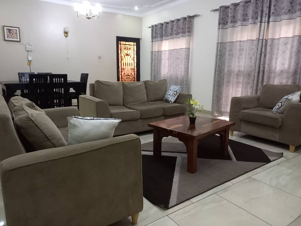 Spacious furnished apartment Makindye showing work-life space separation for business travelers Spacious furnished apartment Makindye showing work-life space separation for business travelers